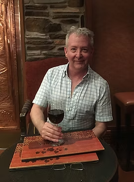 Richard Tyler Jordan with a glass of red wine